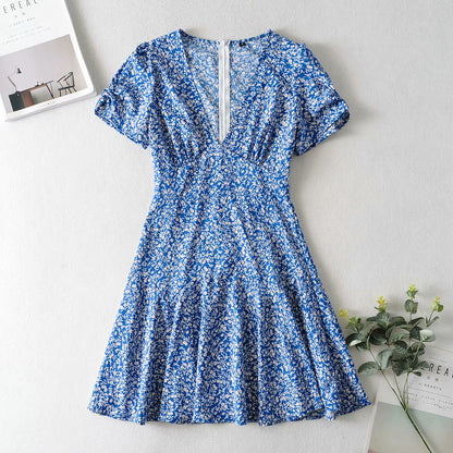 a blue and white dress sitting on top of a table