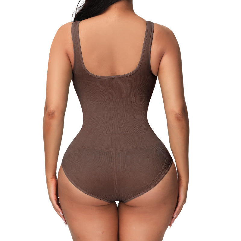 a woman in a brown bodysuit